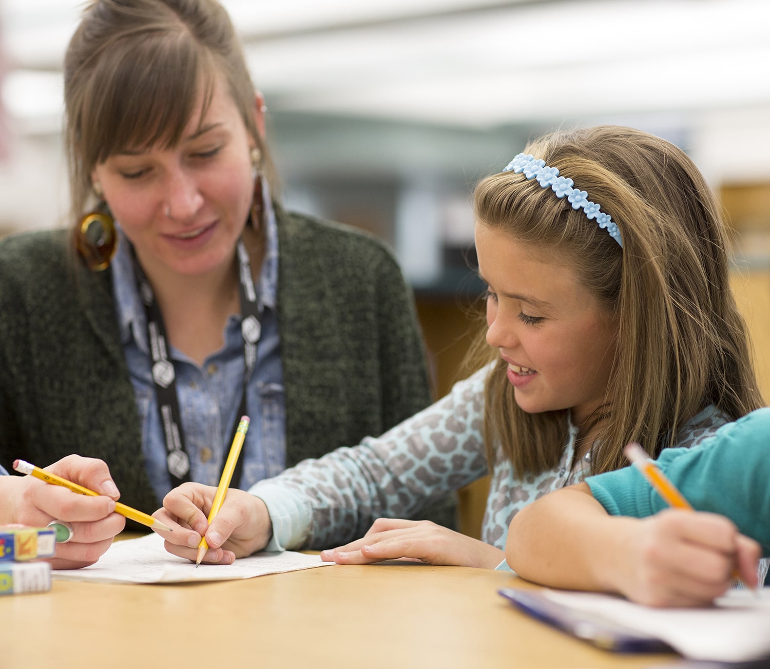 mentor teaching young girl