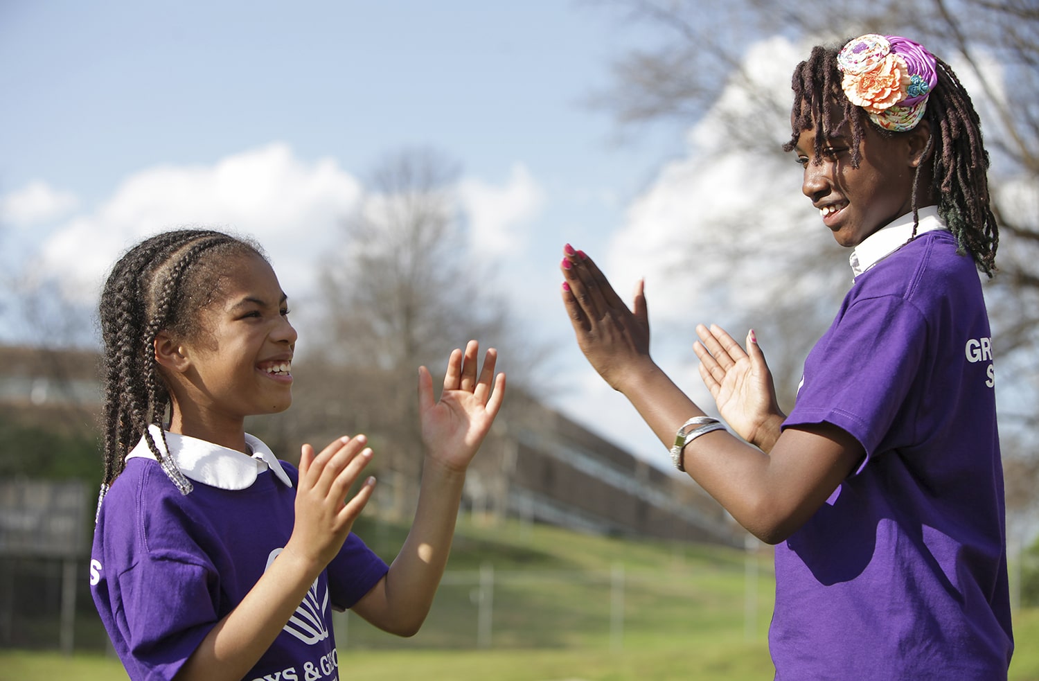 two girls playing clapping games