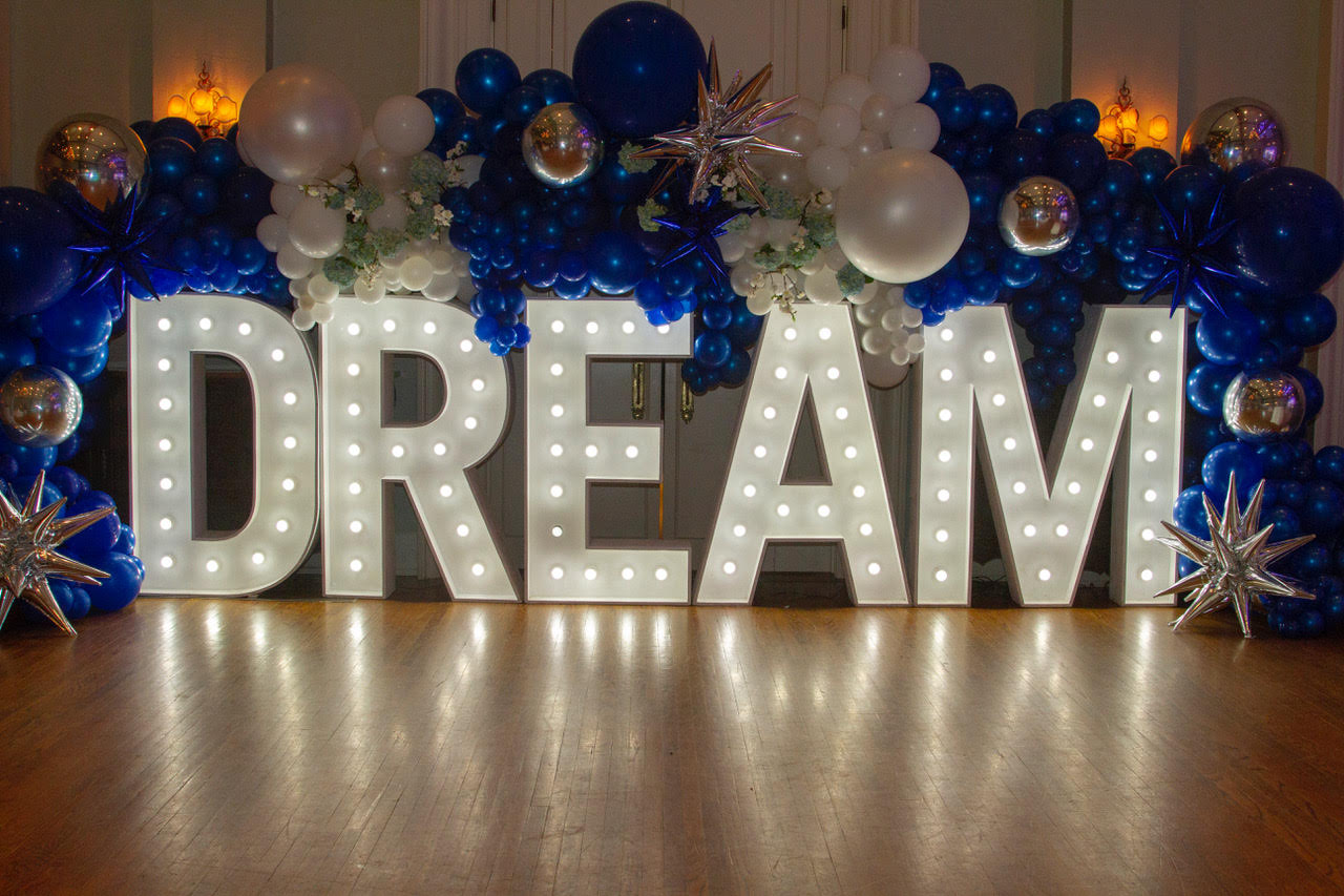 dream in big letters at club event
