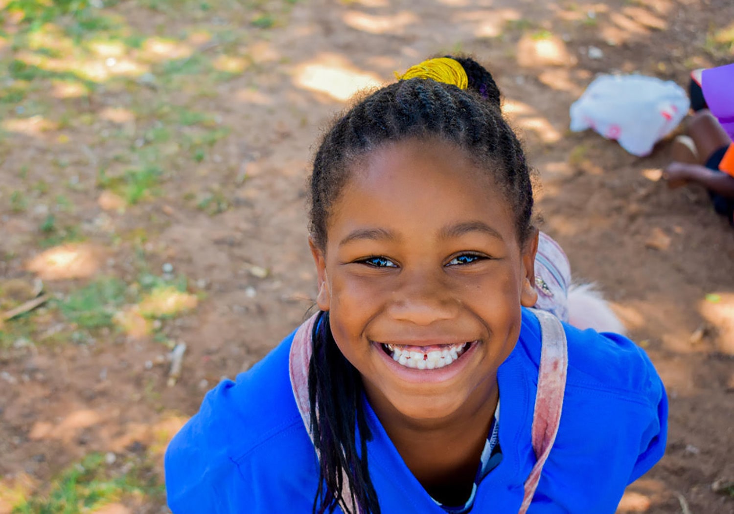 girl smiling big